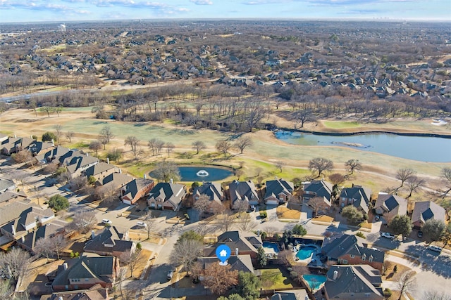 drone / aerial view with a water view and a residential view