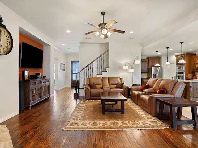 living area with stairs, dark wood-style flooring, recessed lighting, and baseboards