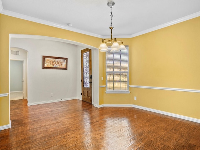7132 Goodnight Ranch Rd, North Richland Hills, TX 76182 - empty room featuring arched walkways, a chandelier, crown molding, and wood finished floors