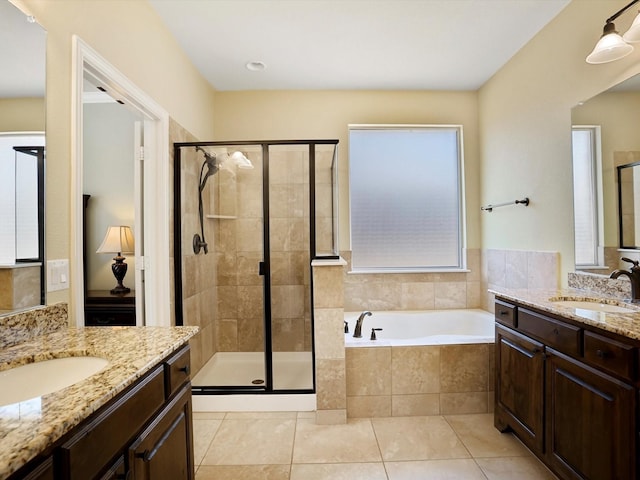 7132 Goodnight Ranch Rd, North Richland Hills, TX 76182 - full bath featuring a stall shower, two vanities, a bath, and tile patterned flooring