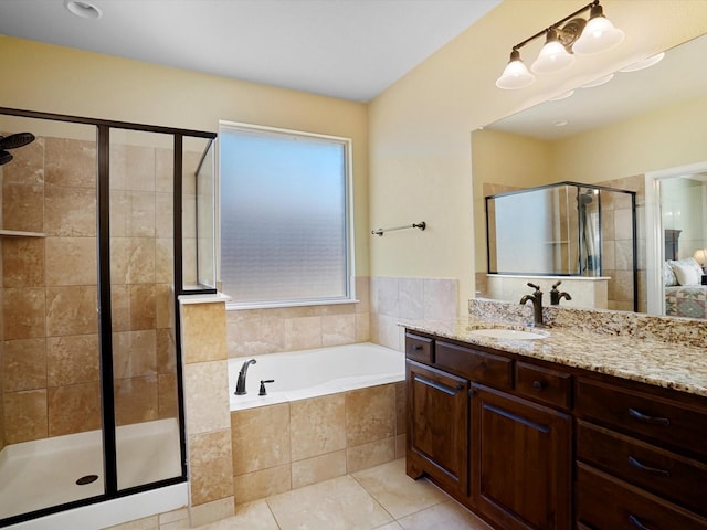 7132 Goodnight Ranch Rd, North Richland Hills, TX 76182 - bathroom with a stall shower, a garden tub, tile patterned flooring, and vanity