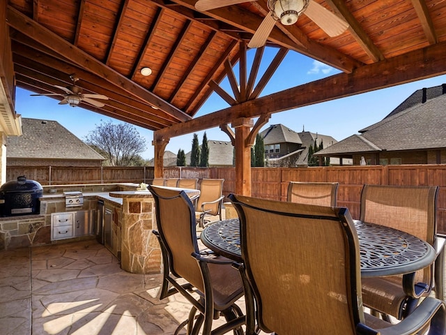 view of patio / terrace featuring a grill, ceiling fan, a fenced backyard, and area for grilling