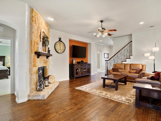 7132 Goodnight Ranch Rd, North Richland Hills, TX 76182 - living room featuring arched walkways, wood finished floors, a ceiling fan, stairway, and recessed lighting