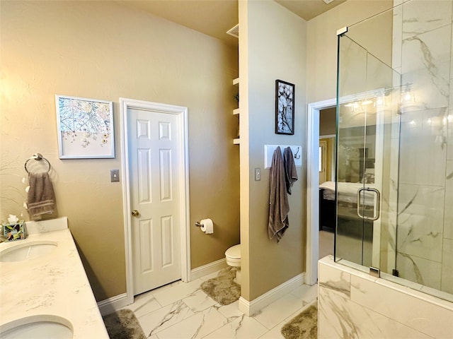 bathroom featuring double vanity, a stall shower, baseboards, marble finish floor, and a sink