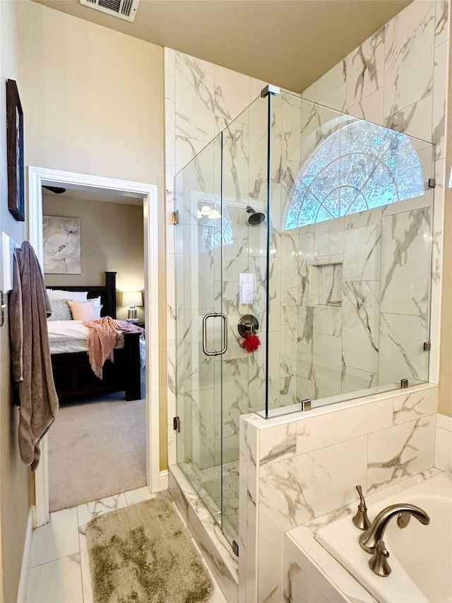 bathroom with a garden tub, visible vents, marble finish floor, a marble finish shower, and ensuite bath