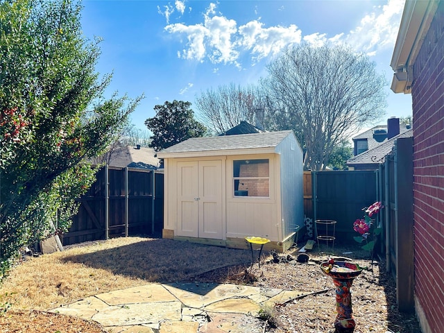 view of shed featuring a fenced backyard