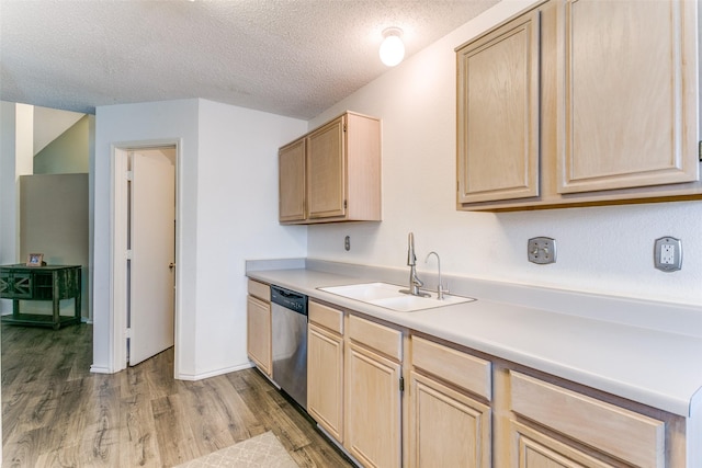 kitchen featuring a sink, wood finished floors, dishwasher, and light brown cabinetry