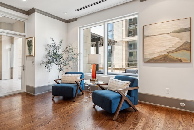 2300 Wolf St Unit 3D, Dallas, TX 75201 - living area featuring crown molding, baseboards, and wood finished floors