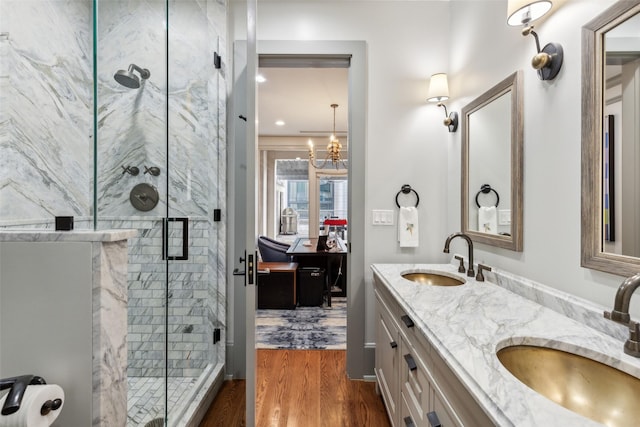 2300 Wolf St Unit 3D, Dallas, TX 75201 - bathroom with a stall shower, a sink, and wood finished floors