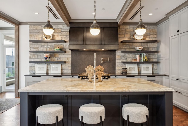2300 Wolf St Unit 3D, Dallas, TX 75201 - bar with dark wood finished floors, decorative light fixtures, and crown molding