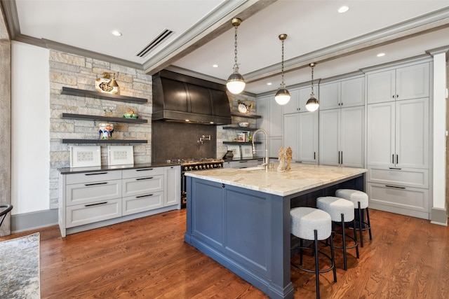 2300 Wolf St Unit 3D, Dallas, TX 75201 - kitchen with a sink, visible vents, dark wood-style floors, open shelves, and custom range hood