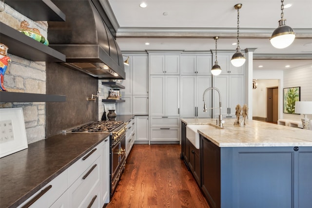 2300 Wolf St Unit 3D, Dallas, TX 75201 - kitchen with a sink, custom exhaust hood, light stone countertops, tasteful backsplash, and stainless steel range