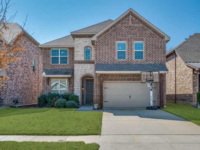 view of front of property with driveway, a garage, a shingled roof, brick siding, and a front yard