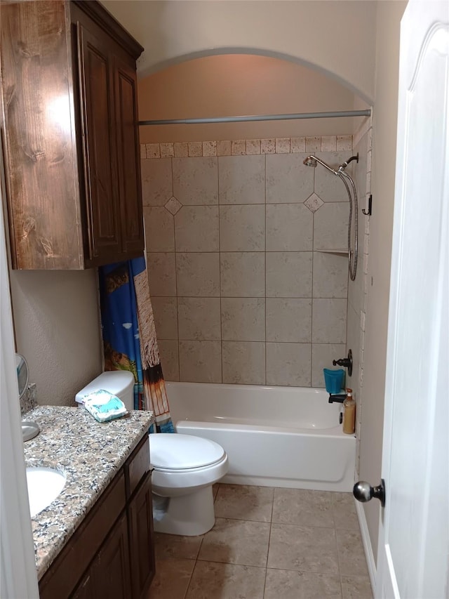 bathroom featuring tile patterned floors, toilet, shower / bath combo, and vanity