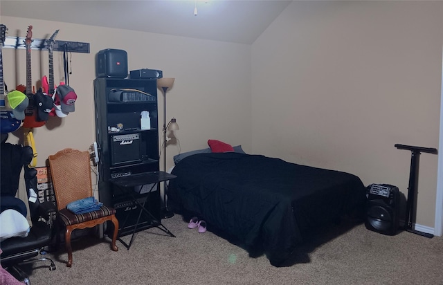 bedroom featuring carpet floors and lofted ceiling