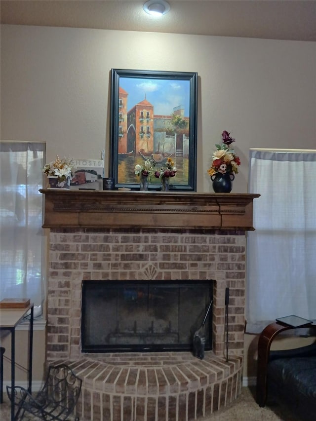 interior details featuring carpet flooring, a fireplace, and baseboards