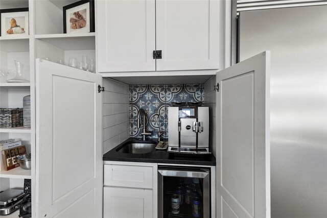 5949 County Road 137, Flint, TX 75762 - bar featuring wine cooler, decorative backsplash, a sink, and built in fridge