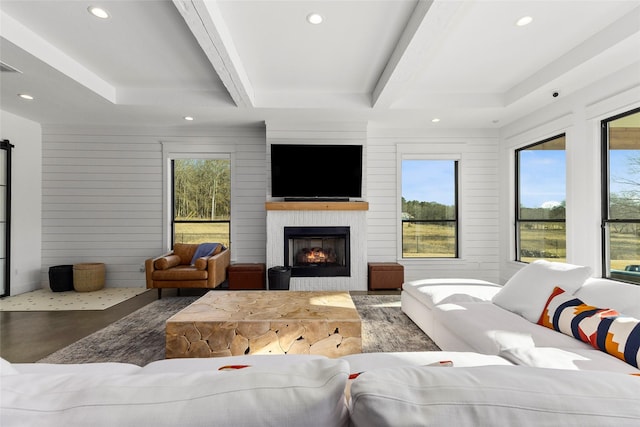 5949 County Road 137, Flint, TX 75762 - living room featuring recessed lighting, a fireplace, and beam ceiling