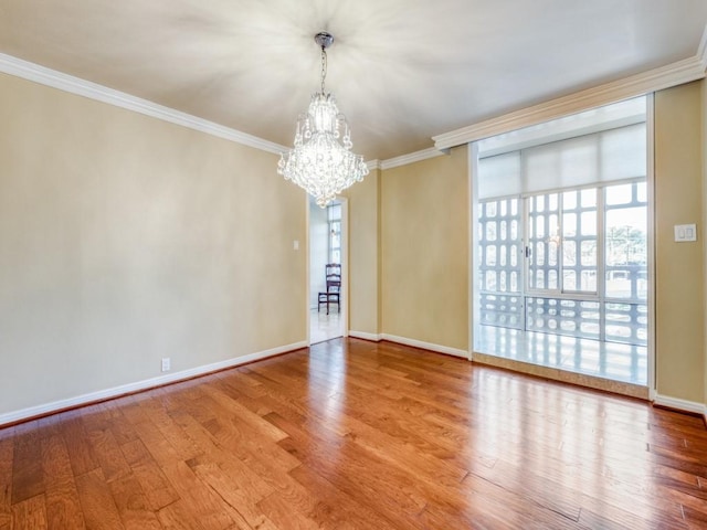 3525 Turtle Creek Blvd Unit 3D, Dallas, TX 75219 - empty room with a chandelier, wood finished floors, crown molding, and baseboards