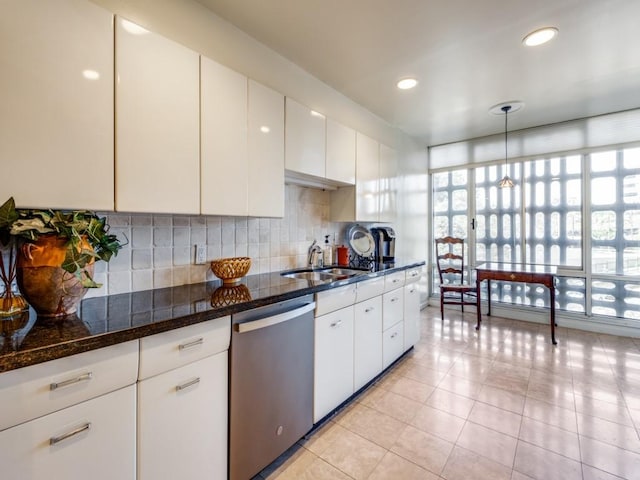 3525 Turtle Creek Blvd Unit 3D, Dallas, TX 75219 - kitchen featuring dishwasher, a sink, light tile patterned floors, backsplash, and recessed lighting