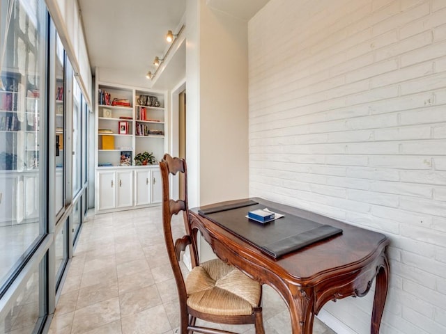 3525 Turtle Creek Blvd Unit 3D, Dallas, TX 75219 - dining space featuring light tile patterned flooring and rail lighting