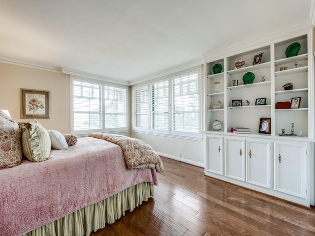 3525 Turtle Creek Blvd Unit 3D, Dallas, TX 75219 - bedroom featuring dark wood-style flooring, crown molding, and baseboards