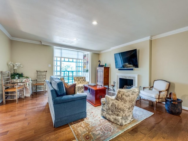 3525 Turtle Creek Blvd Unit 3D, Dallas, TX 75219 - living room with crown molding, wood finished floors, a premium fireplace, and recessed lighting