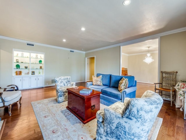 3525 Turtle Creek Blvd Unit 3D, Dallas, TX 75219 - living room with crown molding, wood finished floors, recessed lighting, and a chandelier