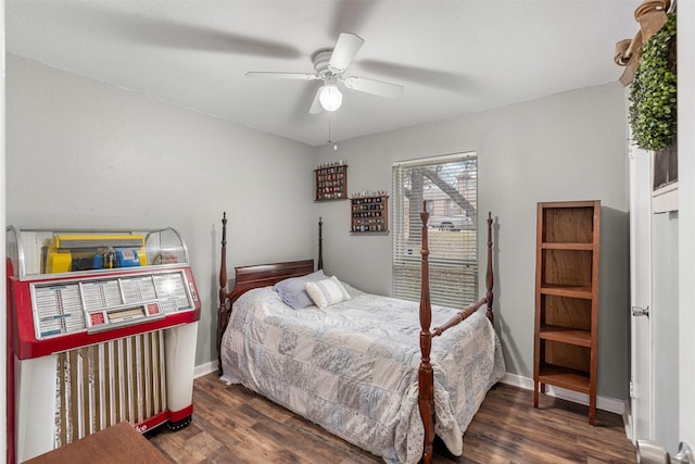 bedroom with ceiling fan, wood finished floors, and baseboards