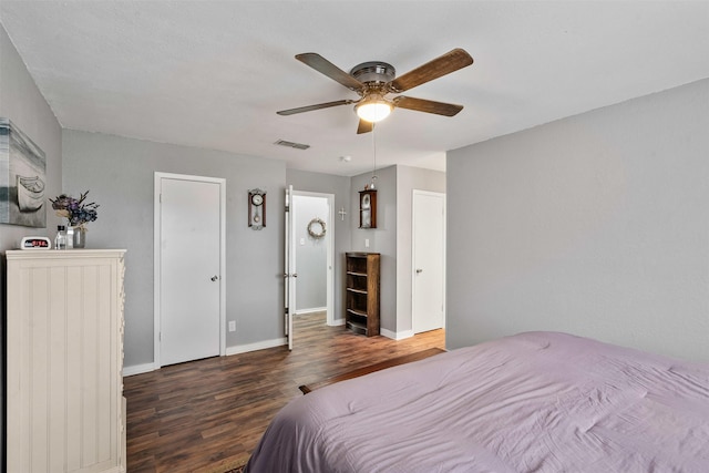 bedroom with visible vents, ceiling fan, baseboards, and wood finished floors