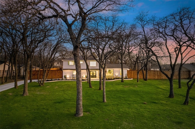 exterior space featuring a yard and fence