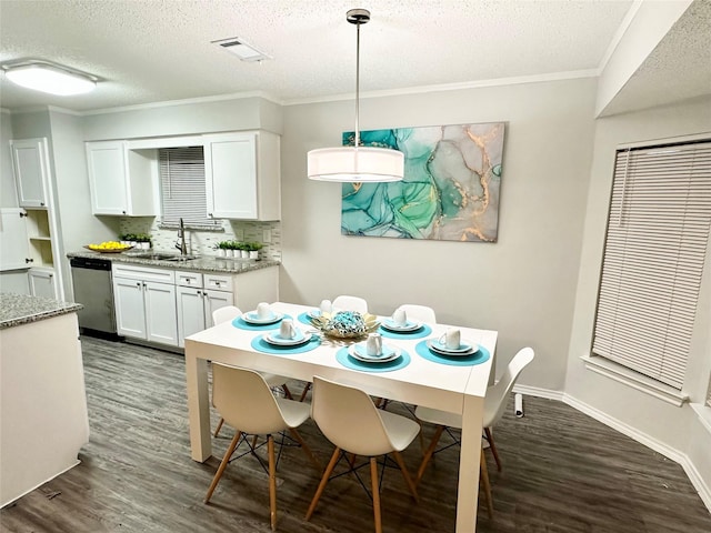 kitchen with a sink, decorative backsplash, appliances with stainless steel finishes, and white cabinets