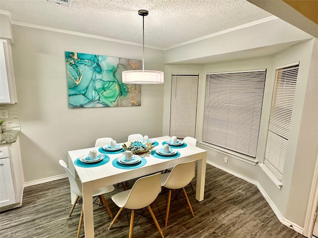 kitchen featuring tasteful backsplash, dishwasher, a sink, white cabinets, and ornamental molding