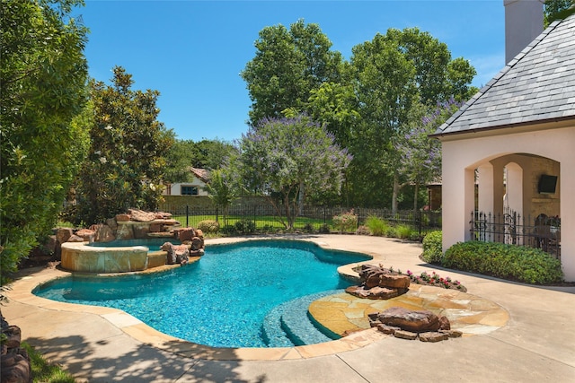 view of swimming pool with a fenced in pool, a hot tub, a patio, and fence