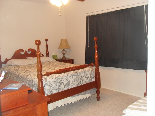 bedroom featuring carpet floors and baseboards