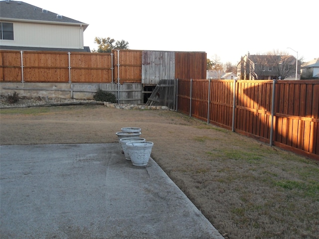 view of yard with a fenced backyard