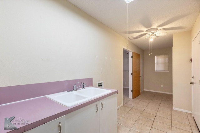 bathroom with ceiling fan, baseboards, vanity, and tile patterned floors