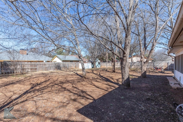 view of yard with a fenced backyard