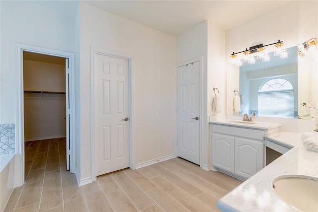 bathroom featuring vanity and wood finished floors
