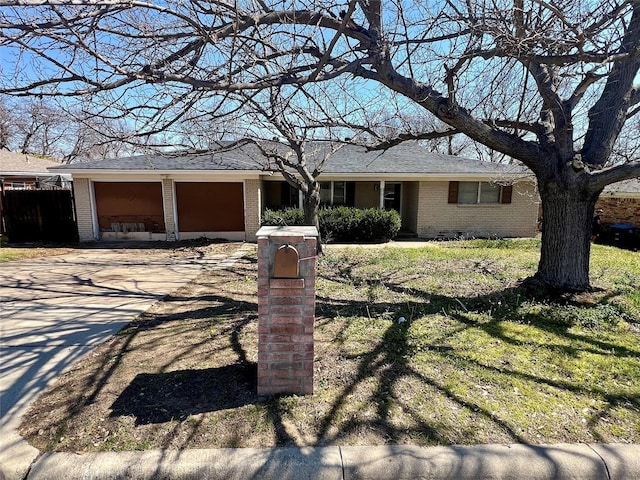 ranch-style house with crawl space, driveway, a garage, and brick siding