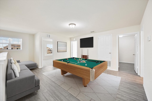 game room with light wood finished floors, baseboards, and pool table