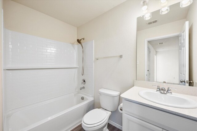 full bathroom featuring toilet, shower / bathing tub combination, vanity, and visible vents