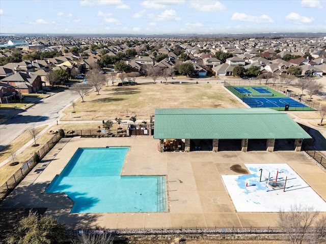 pool featuring a residential view, fence, and a patio