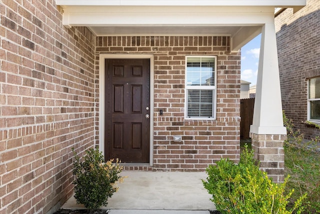 entrance to property with brick siding