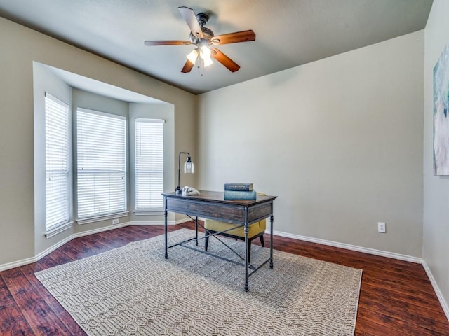 home office with ceiling fan, wood finished floors, and baseboards