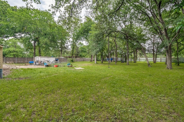 view of yard with a fenced backyard