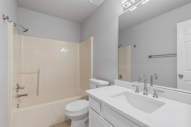 full bathroom featuring visible vents, toilet, a textured ceiling, vanity, and shower / washtub combination