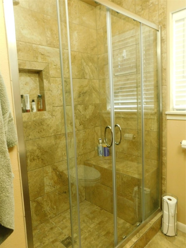 full bath with a shower stall