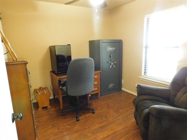 home office featuring wood finished floors, a ceiling fan, and baseboards