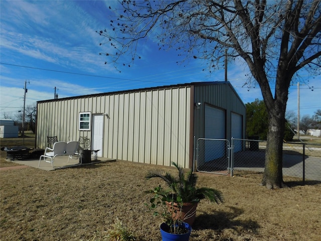 view of outbuilding featuring an outbuilding and fence